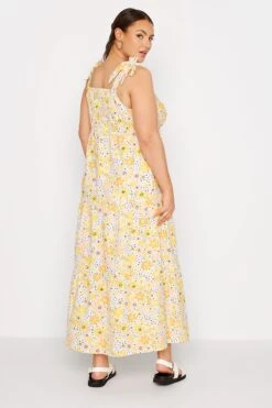 LIMITED COLLECTION - Mouwloze Maxi-jurk Met Retro Bloemen & Bandjes Met Strikdetail In Geel -NAOMI Kleding Winkel 19c50cbf 85d5 42 214490 C